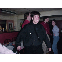 Steve grins cheesily whilst dancing.